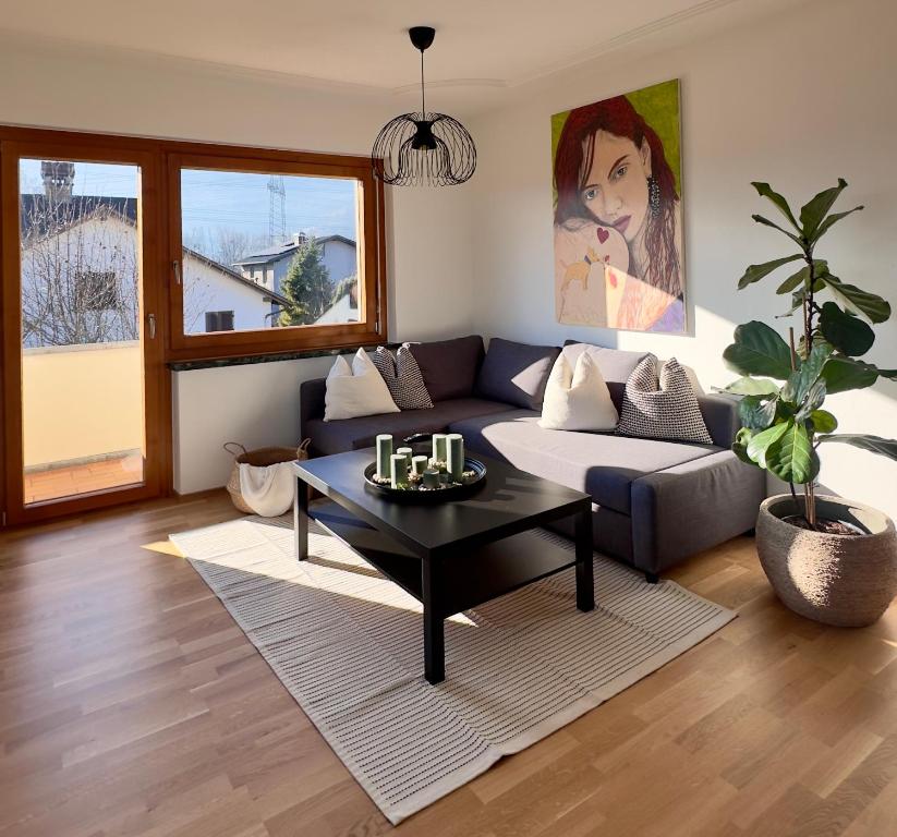 a living room with a couch and a table at Apartment 22 in Schlins
