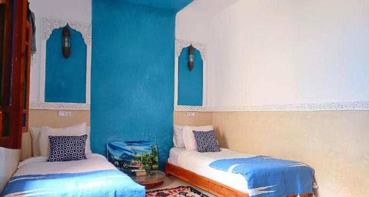 Ένα ή περισσότερα κρεβάτια σε δωμάτιο στο Dar jado