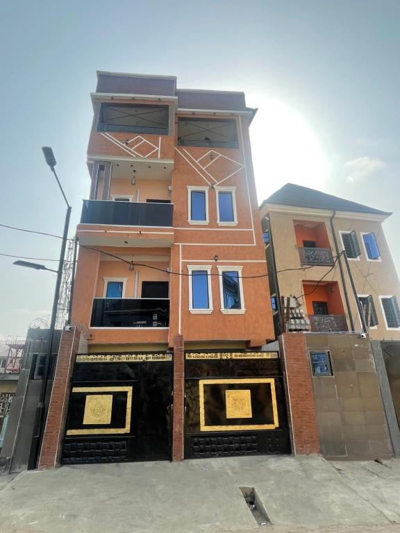 a tall building with windows on the side of it at Blue AO service apartment in Lagos