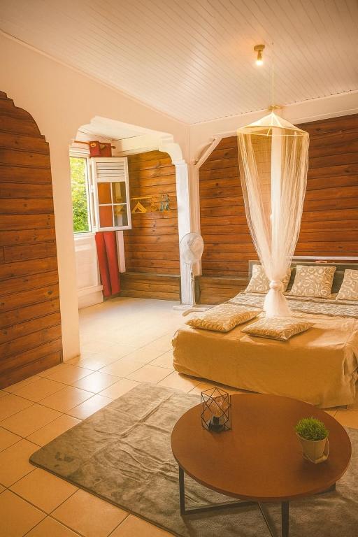 En eller flere senge i et værelse på Cocon Douillet à 10 min du Marin