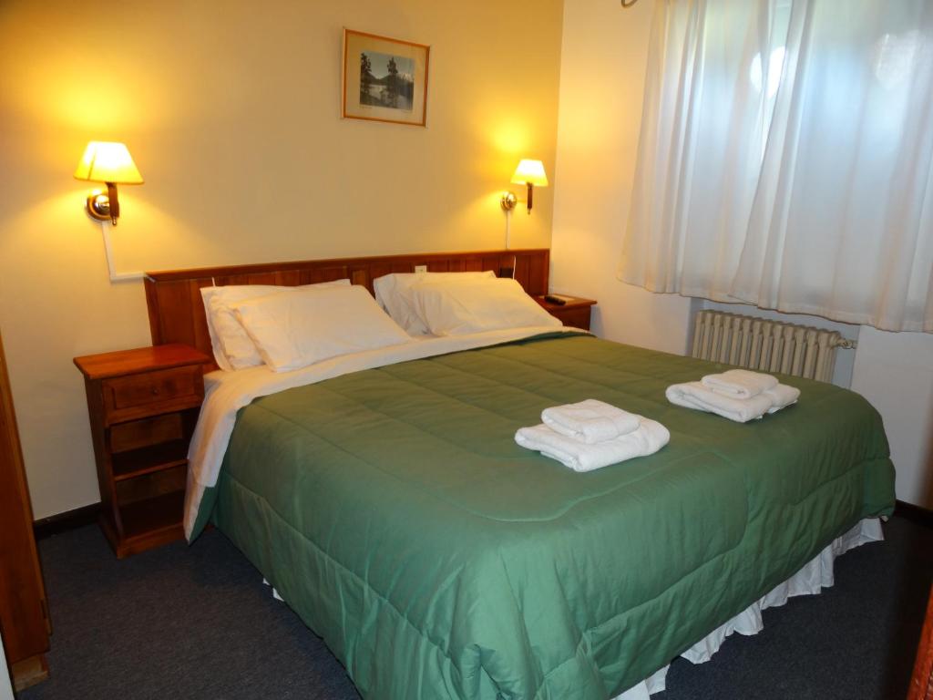 Postel nebo postele na pokoji v ubytování Hosteria La Pastorella