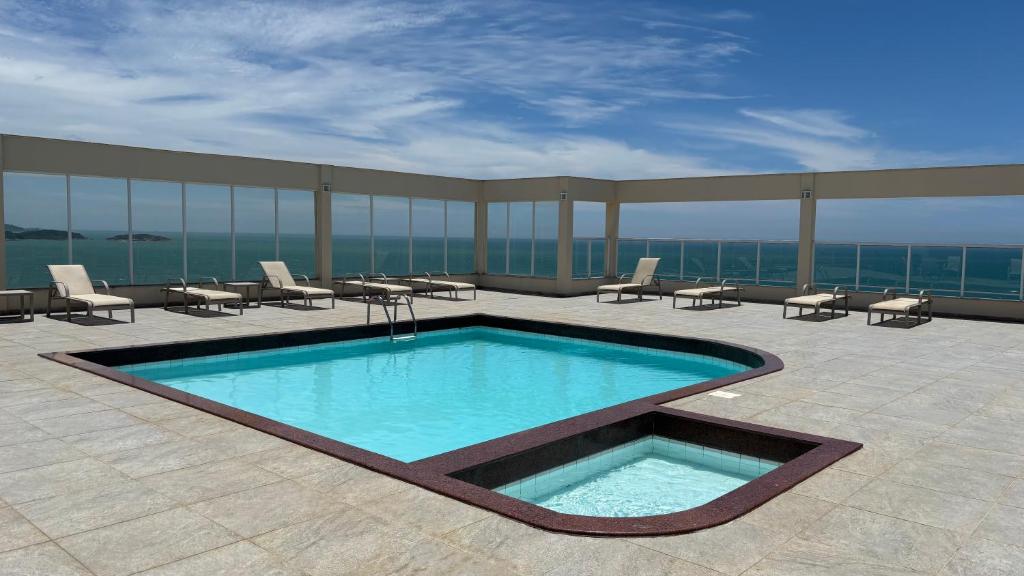 Swimmingpoolen hos eller tæt på Areia Flat vista mar piscina e ar