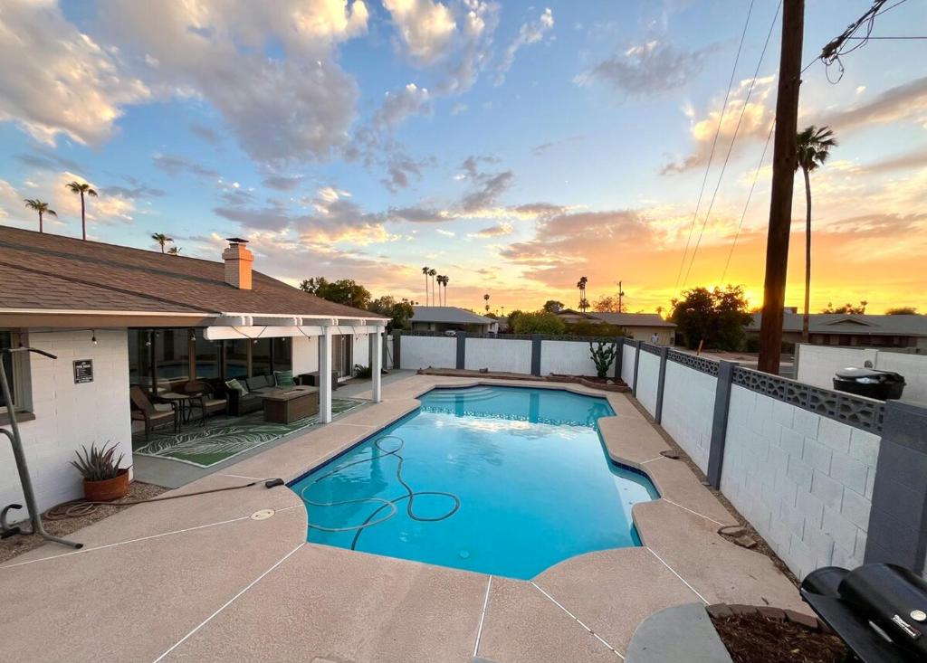 a swimming pool in the backyard of a house at Pool paradise near ASU campus & Scottsdale in Tempe