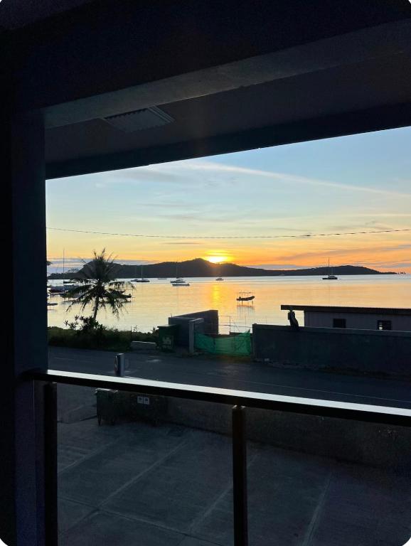 a view of a sunset from a window at Amanahune Lodge - Bora Bora in Bora Bora
