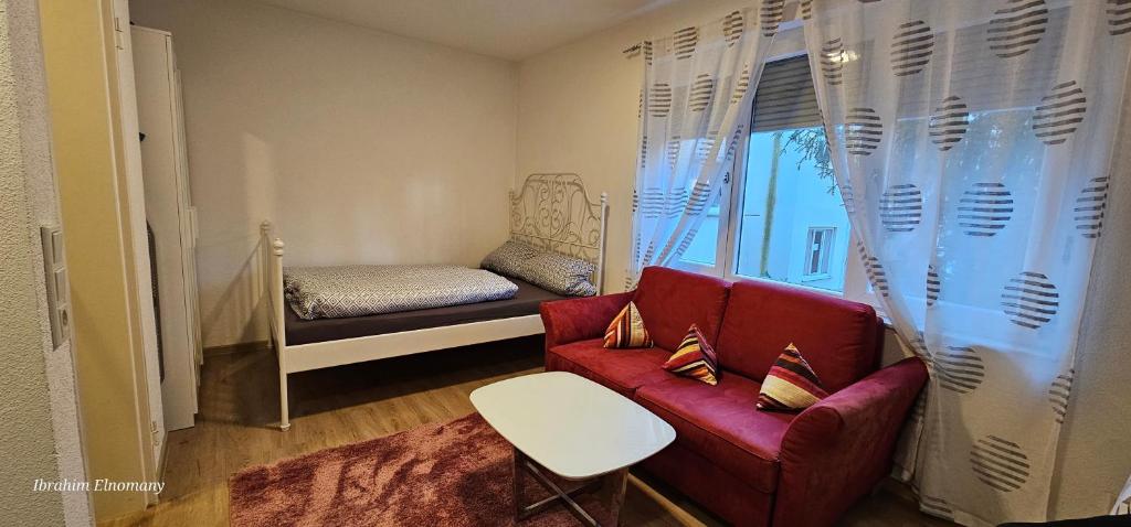 Кровать или кровати в номере Room in Würzburg city center