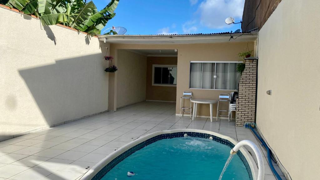 Swimmingpoolen hos eller tæt på Casa de 2 QUARTOS COM PISCINA