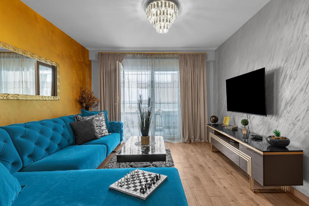 Et tv og/eller underholdning på Apartman Aria De Lux