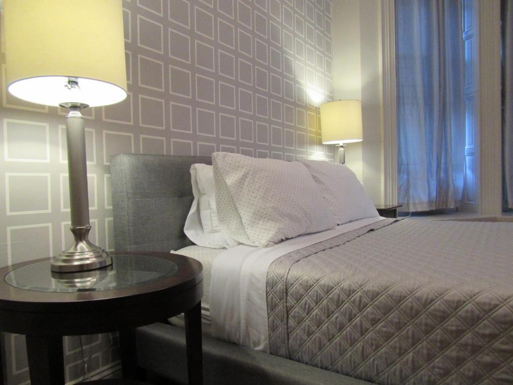 Postel nebo postele na pokoji v ubytování Washington Park Inn
