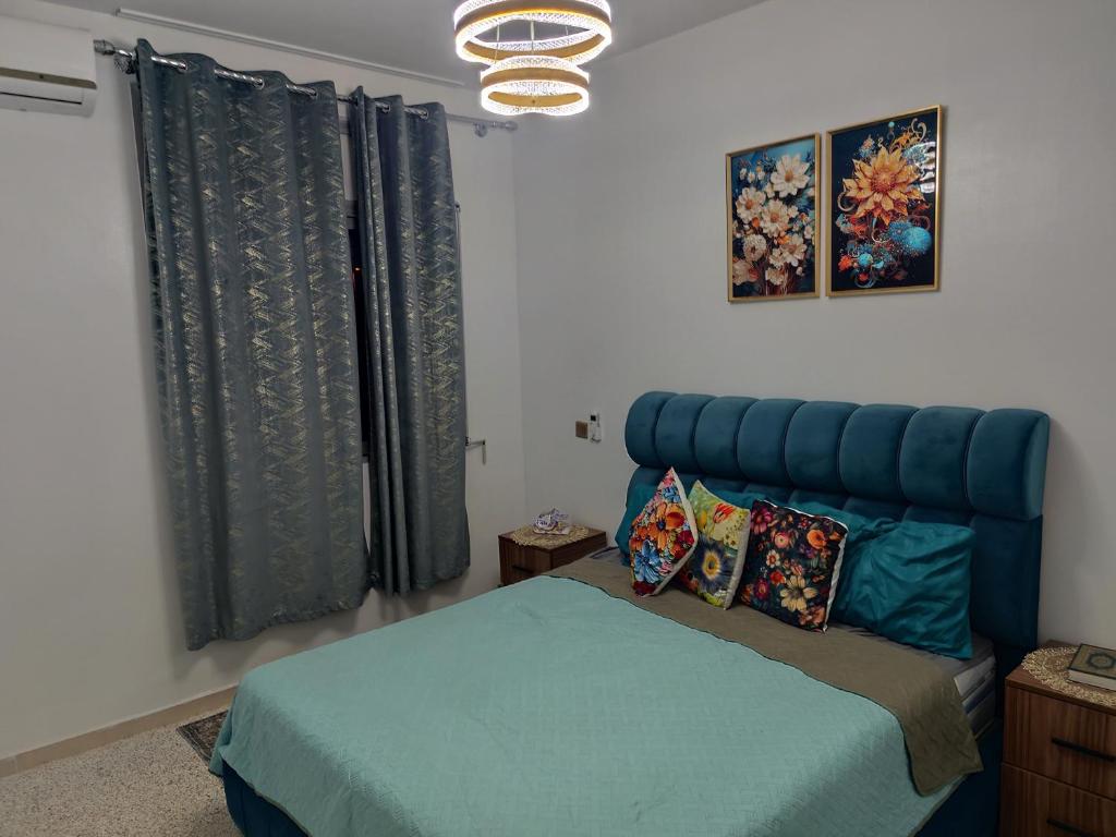 En eller flere senge i et værelse på Appartement a Oulad Mtaa ,Prés du stade Moulay Abdallah,Rabat