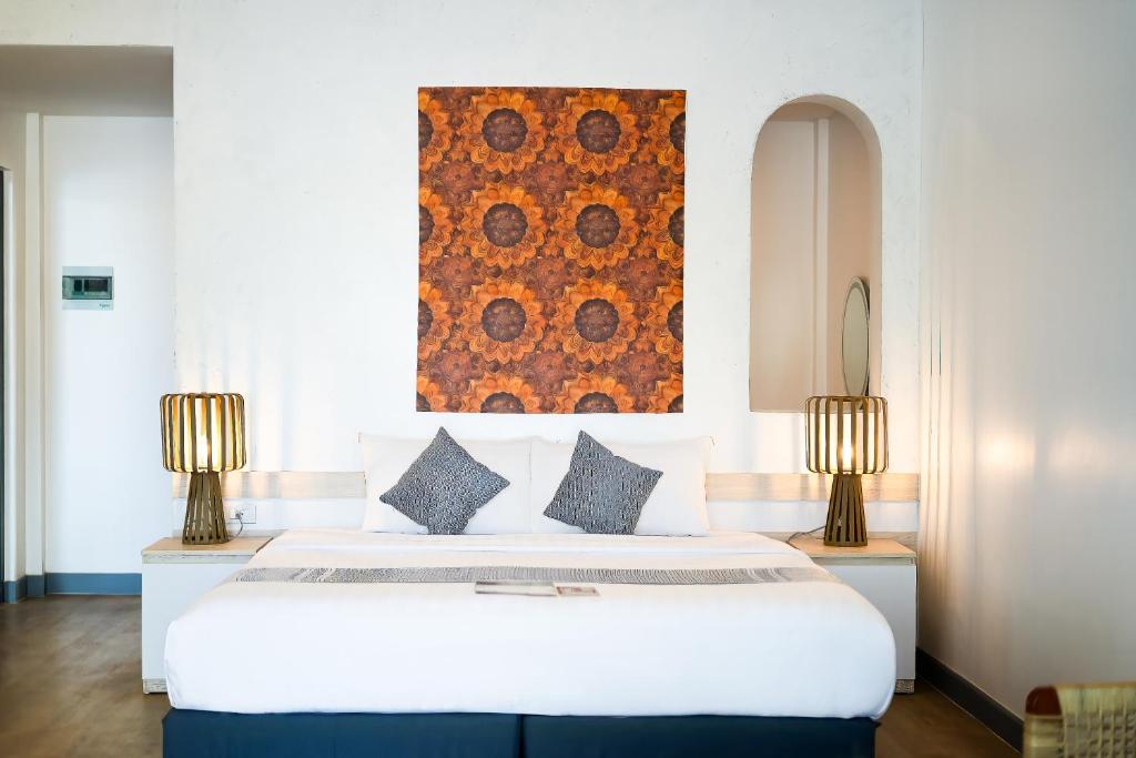 Кровать или кровати в номере The Sanctuary Nam Ngum Beach Resort