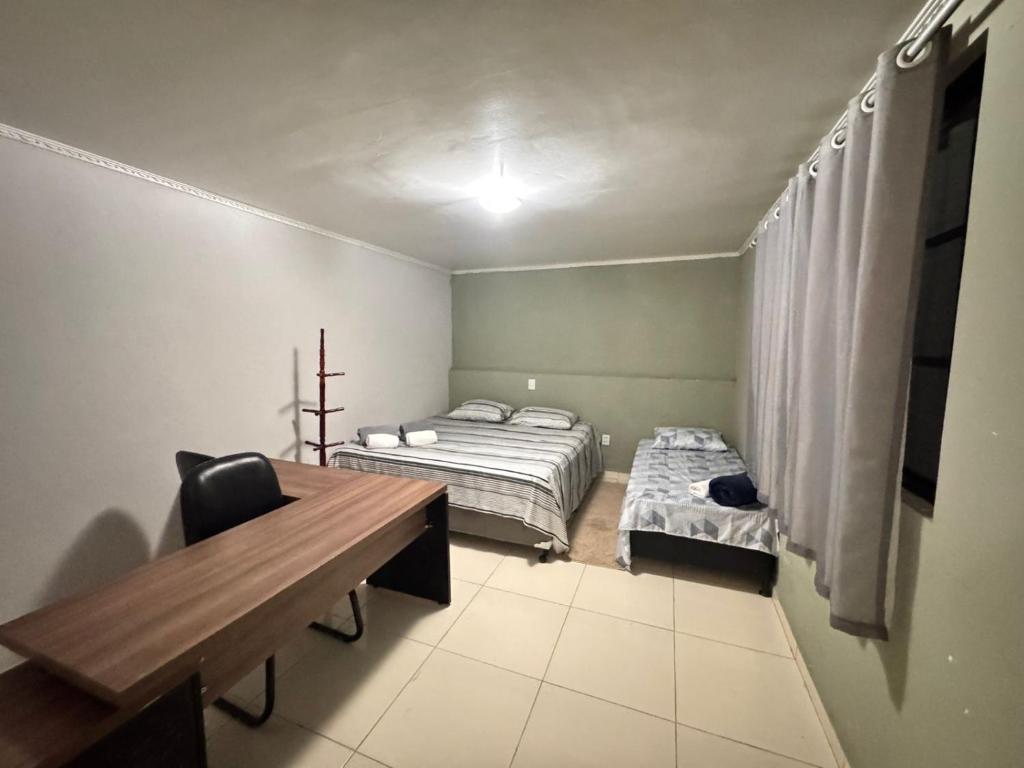 Giường trong phòng chung tại Refúgio premium p até 4 Perto do centro