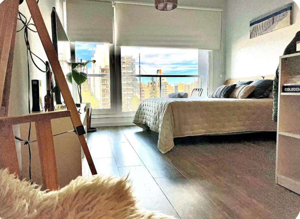 En eller flere senge i et værelse på Premium Studio in Downtown