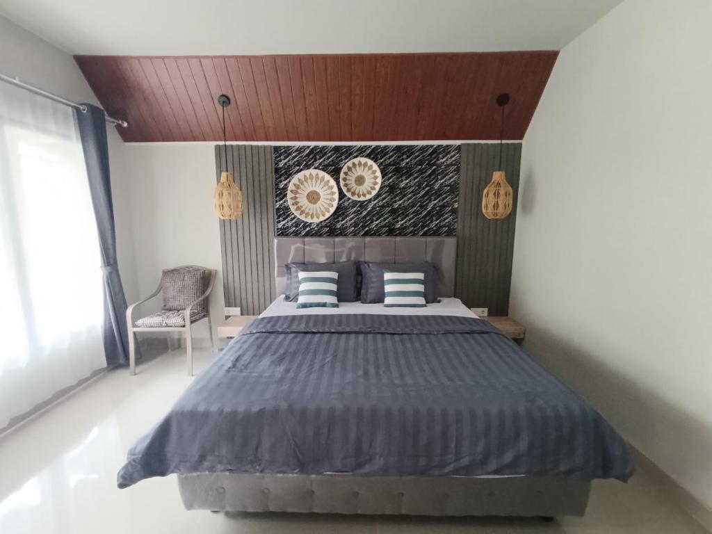 En eller flere senge i et værelse på GHangga Amed