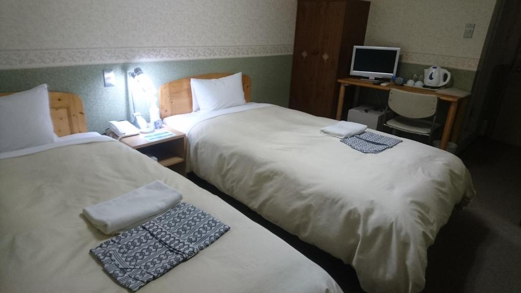 Postel nebo postele na pokoji v ubytování Hotel Himeji Hills