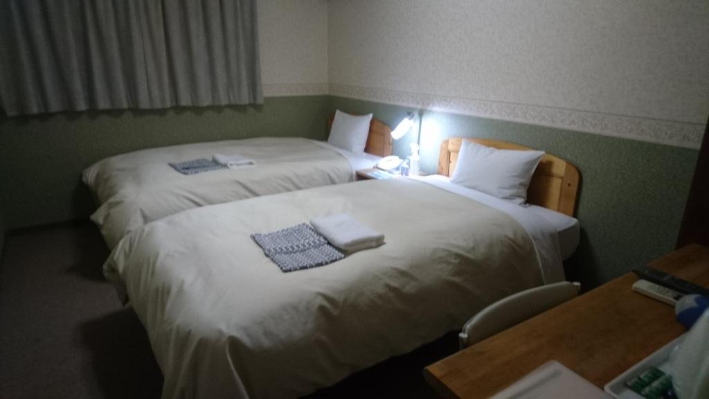 Postel nebo postele na pokoji v ubytování Hotel Himeji Hills