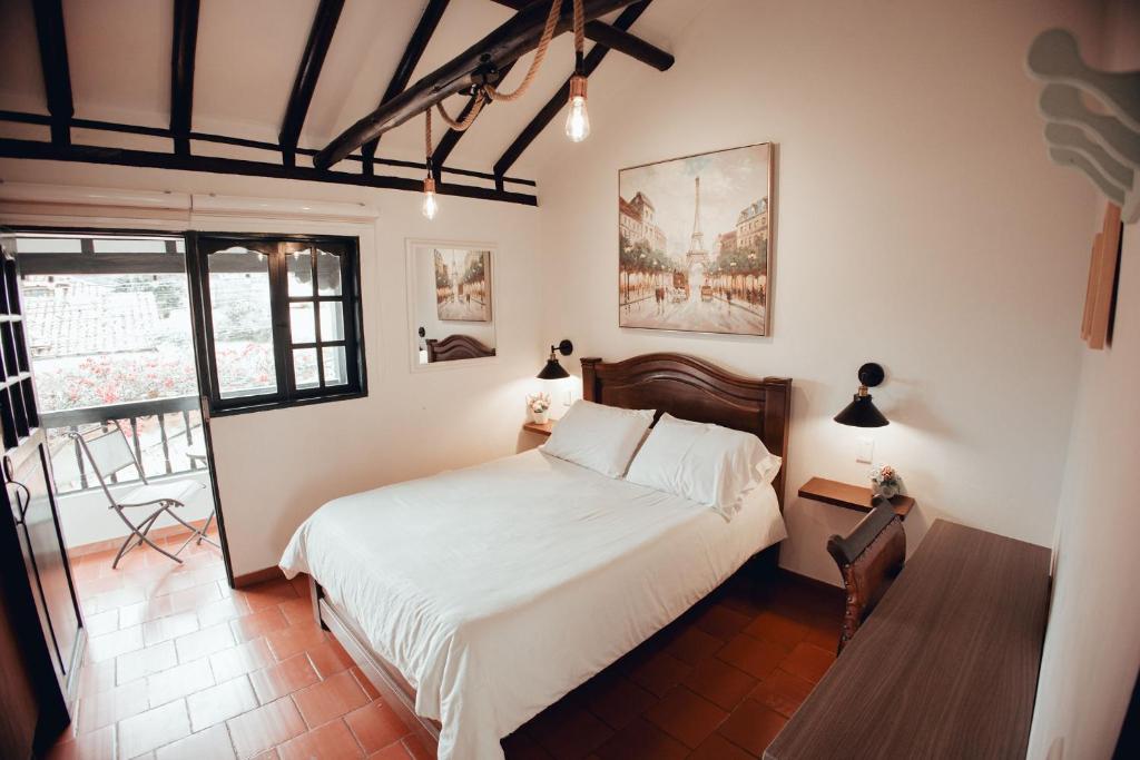 En eller flere senge i et værelse på Casa Villa Pepita