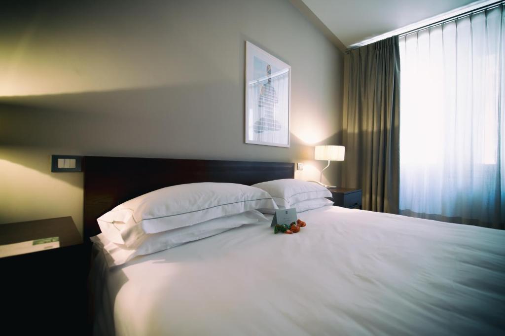 Postel nebo postele na pokoji v ubytování Escalus Luxury Suites Verona
