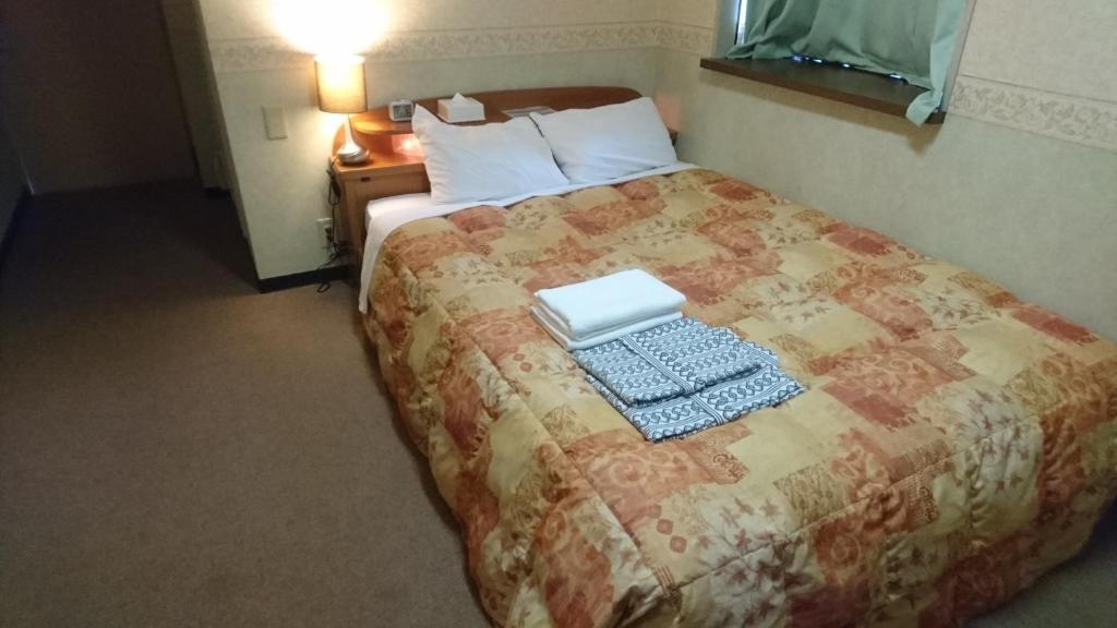 Postel nebo postele na pokoji v ubytování Hotel Himeji Hills
