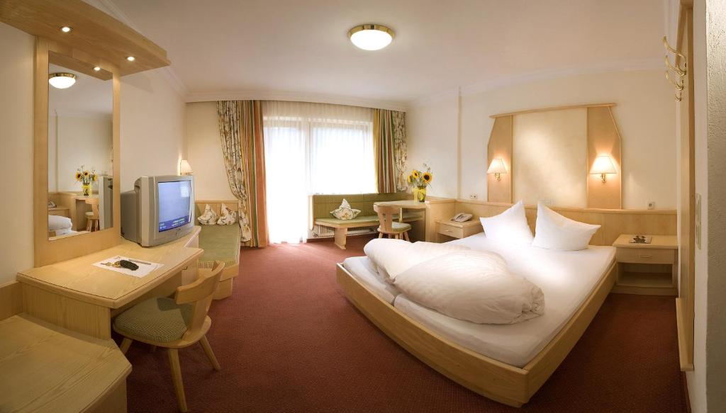 Postel nebo postele na pokoji v ubytování Superior Hotel Persal