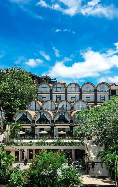 a large building with a lot of windows at Sunny Samudra Boutique hotel Uluwatu in Uluwatu