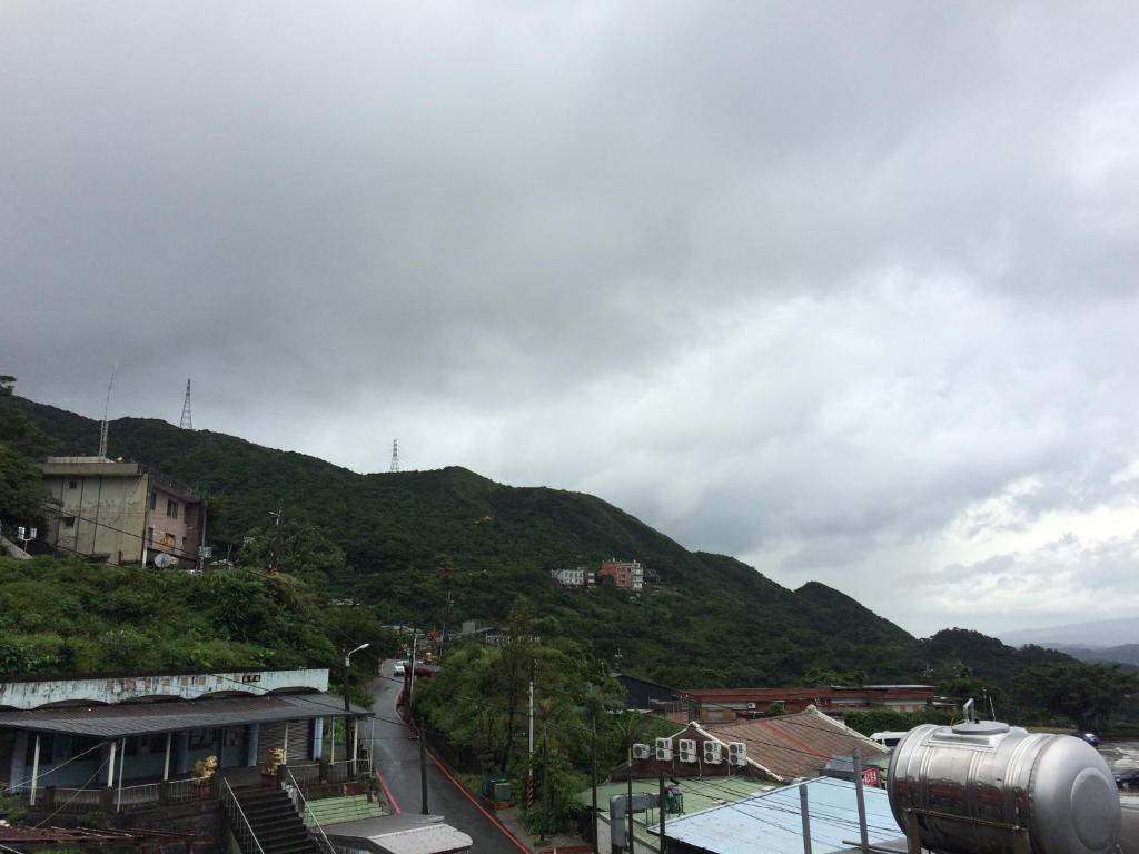 a view of a city with a mountain at Blue Sky B&amp;B in Jiufen