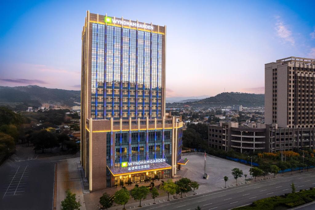 a rendering of a tall building in a city at Wyndham Garden Linxia Downtown in Linxia