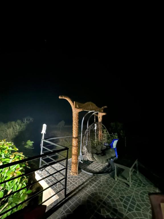 a roller coaster on the deck at night at Narayani view resort in Bharatpur