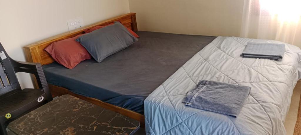 En eller flere senge i et værelse på anvi stay