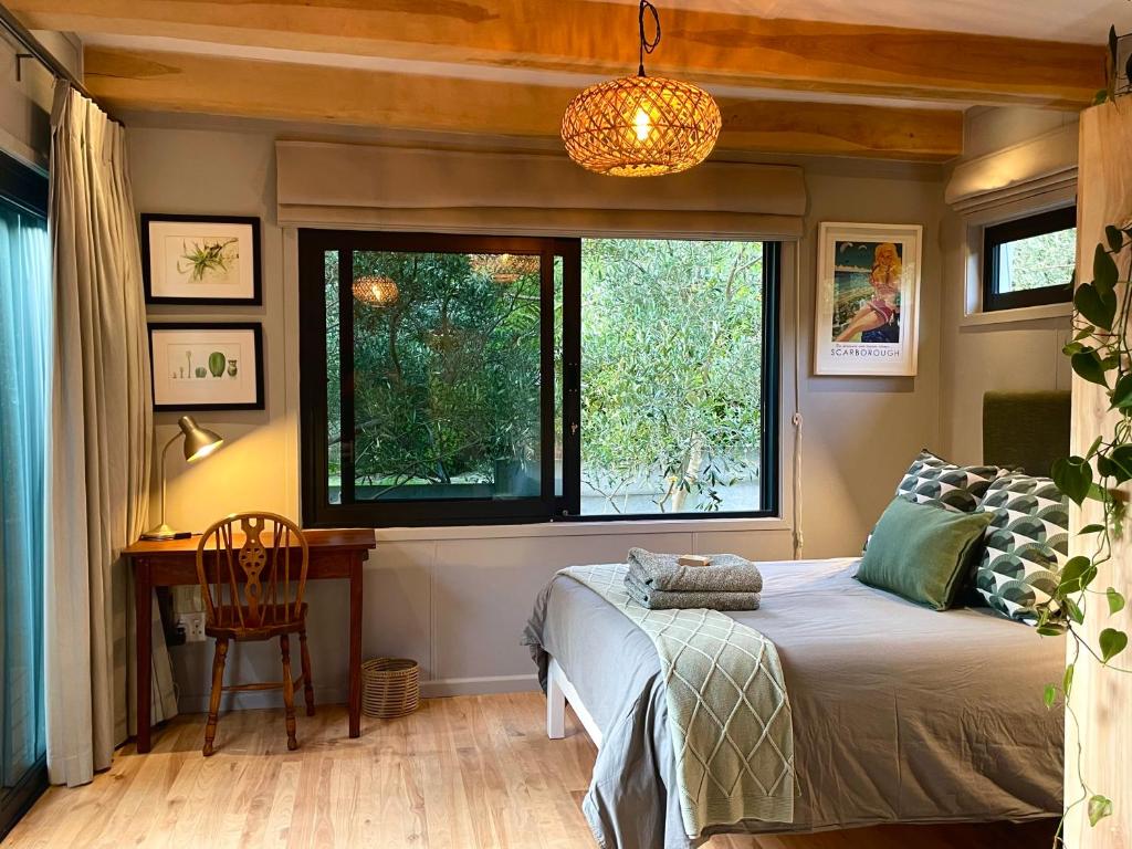 En eller flere senge i et værelse på Olive Cottage Scarborough Seaside Village