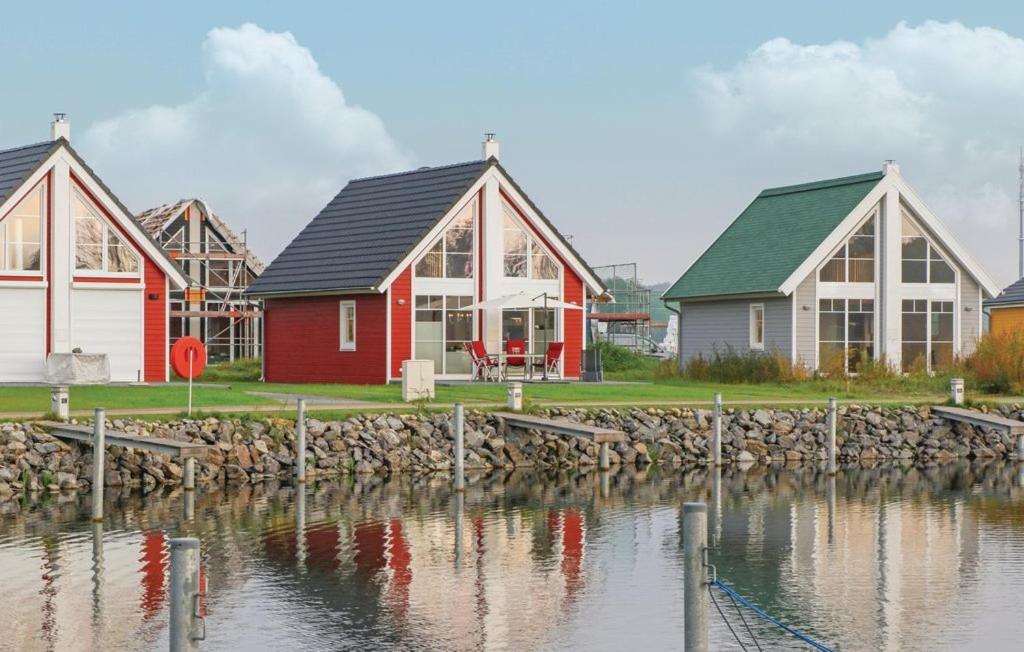 a group of houses next to a body of water at Haus Hafenidyll in Wandlitz