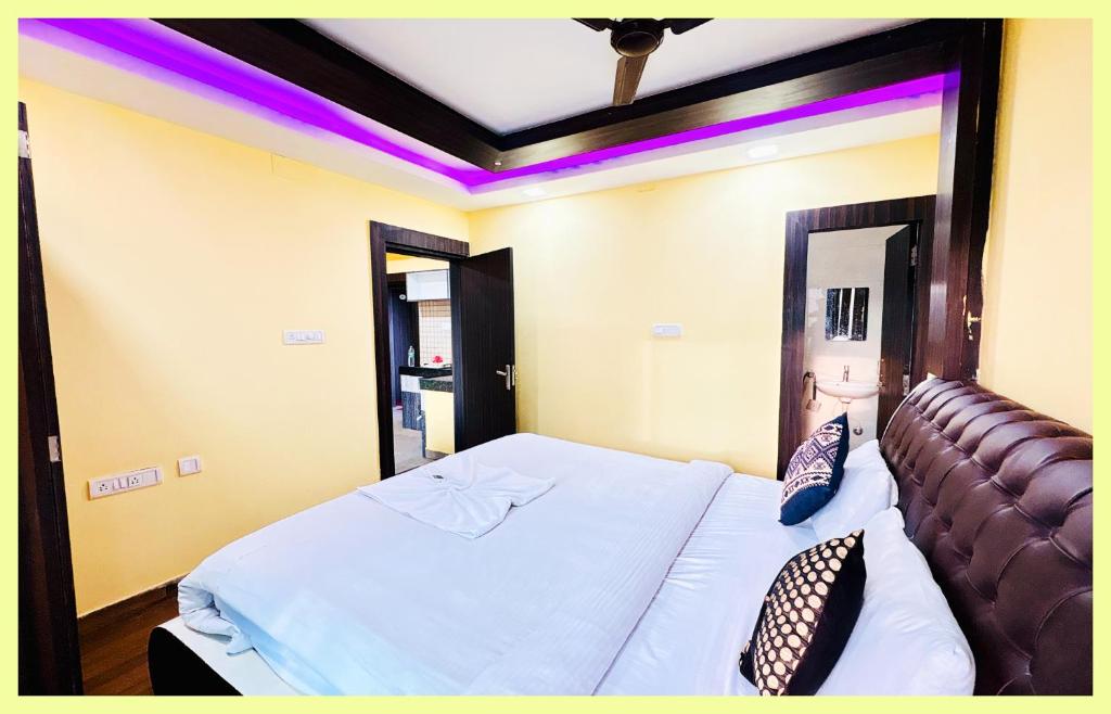 En eller flere senge i et værelse på The Drimea Hapur UP