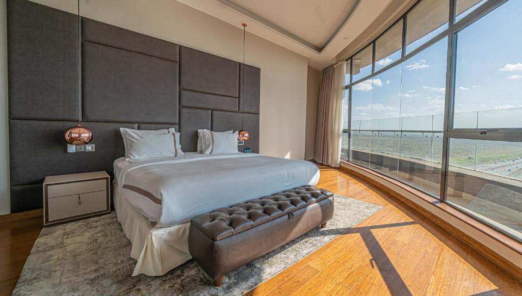 Postel nebo postele na pokoji v ubytování The Curve by the Park Nairobi by TSG