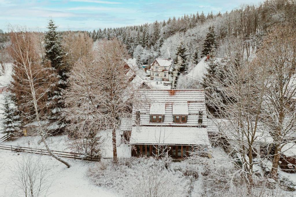 an aerial view of a house covered in snow at Harzchalet Brockenbahn 2A in Elend