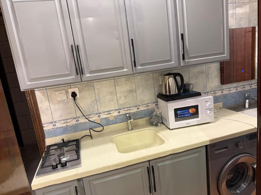 Kuchyň nebo kuchyňský kout v ubytování فندق