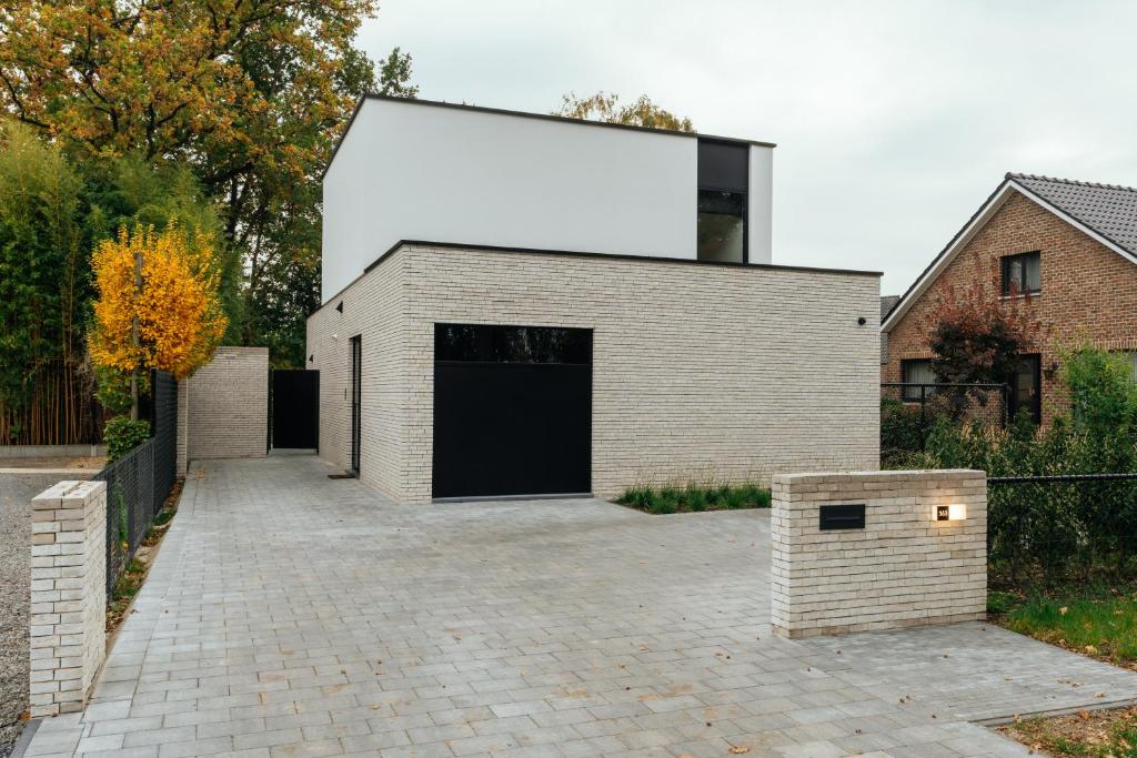 a brick building with a large rectangle on top at Bocca in Hasselt