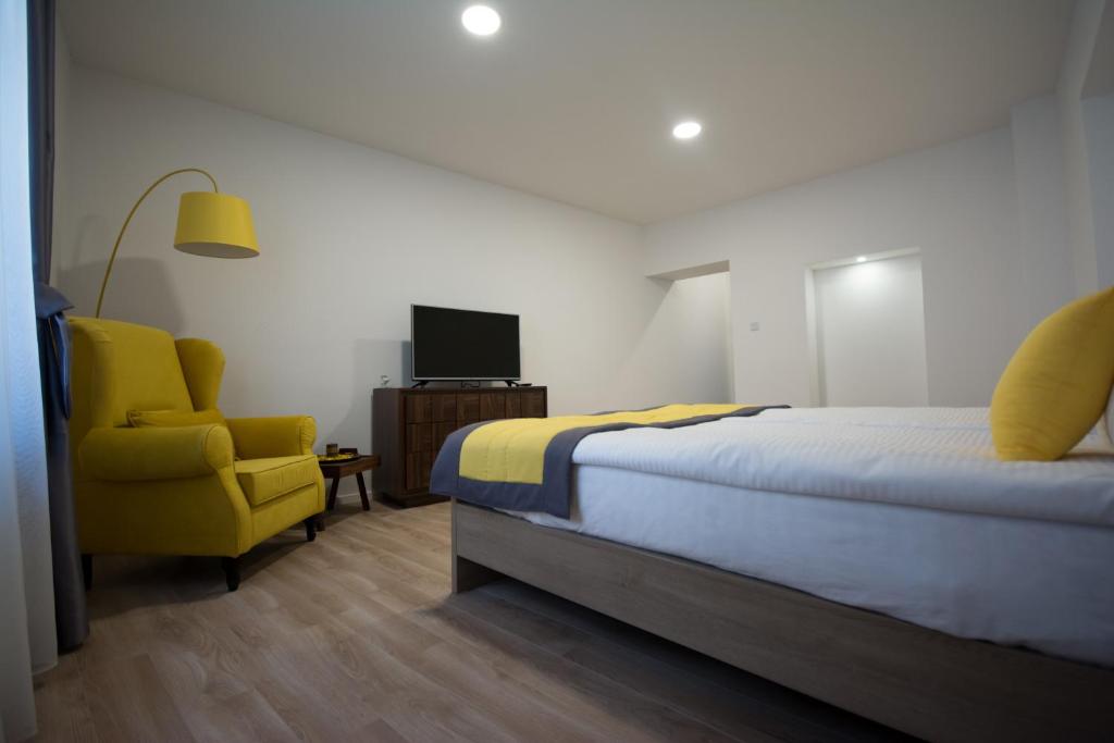 Postel nebo postele na pokoji v ubytování Enjoy Apartments