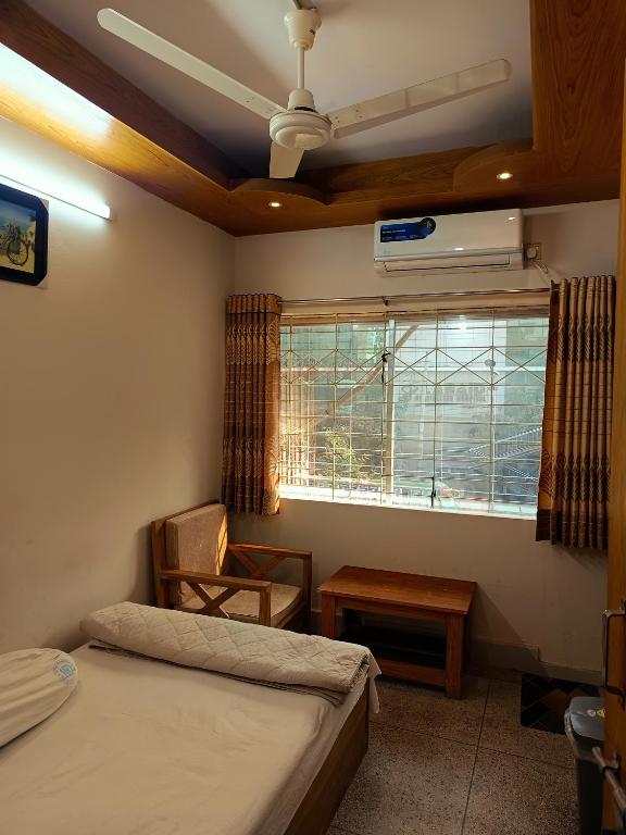 Llit o llits en una habitació de Hotel Dhanmondi