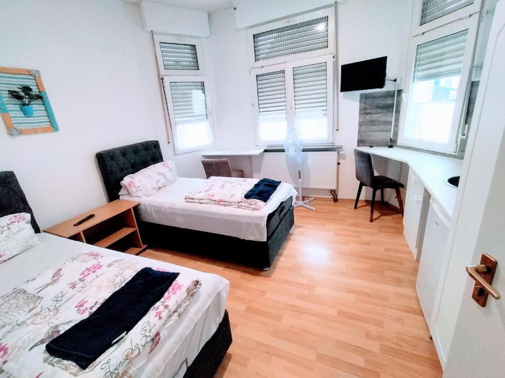 Postel nebo postele na pokoji v ubytování Apartment Haus