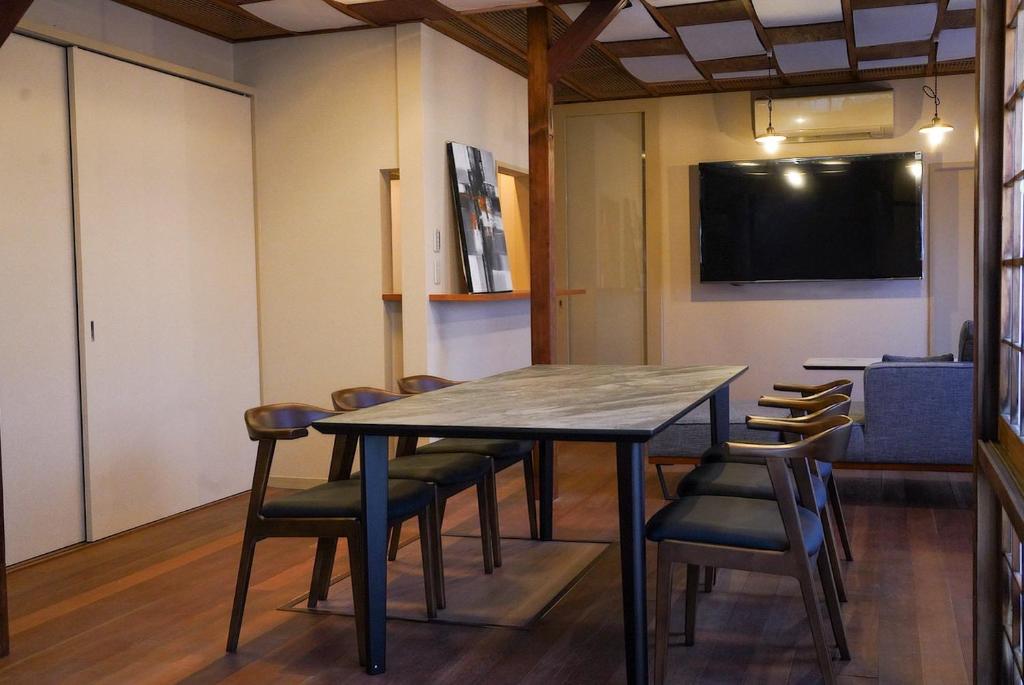 a conference room with a table and chairs at 結びの小宿 縁 by Wellbe in Kobe