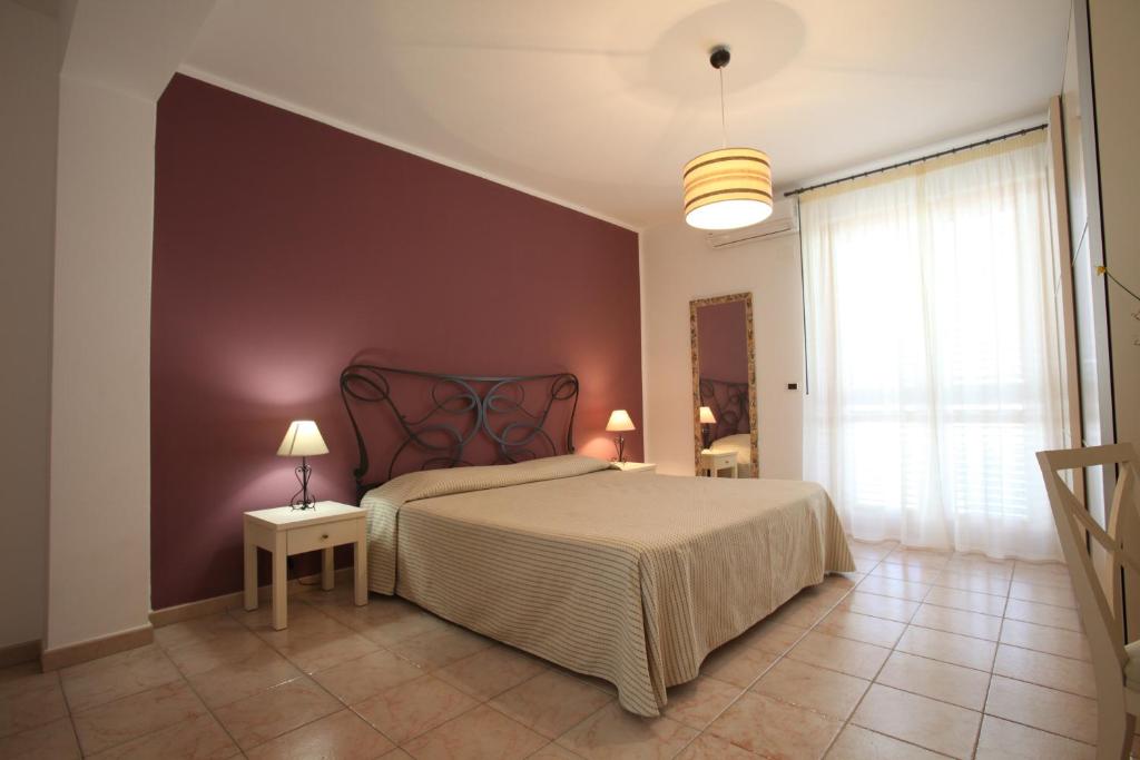 Postel nebo postele na pokoji v ubytování Hotel Amarea - Aeolian Charme
