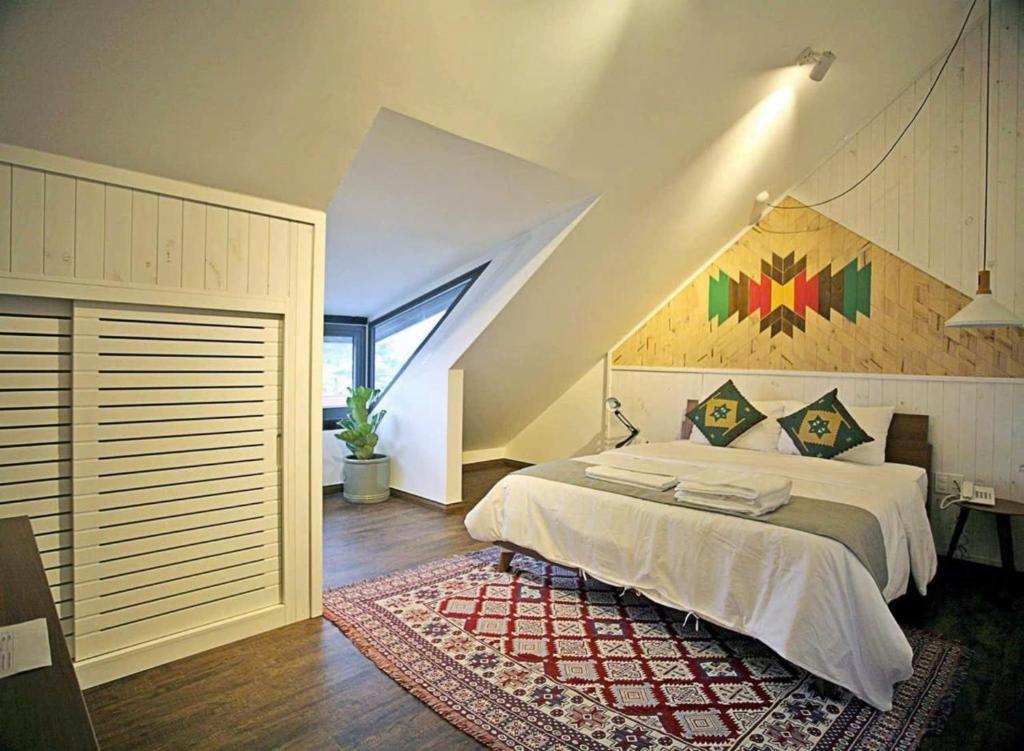 En eller flere senge i et værelse på The Scent Boutique Dalat Hotel