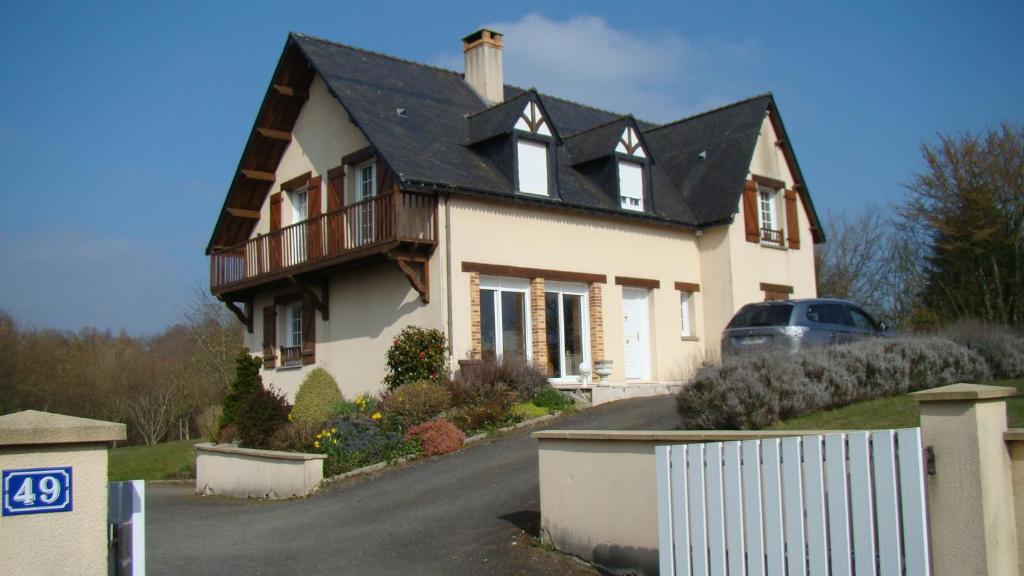 a large white house with a black roof at Chambres d'hôtes Le Bignon in Villaines-la-Juhel