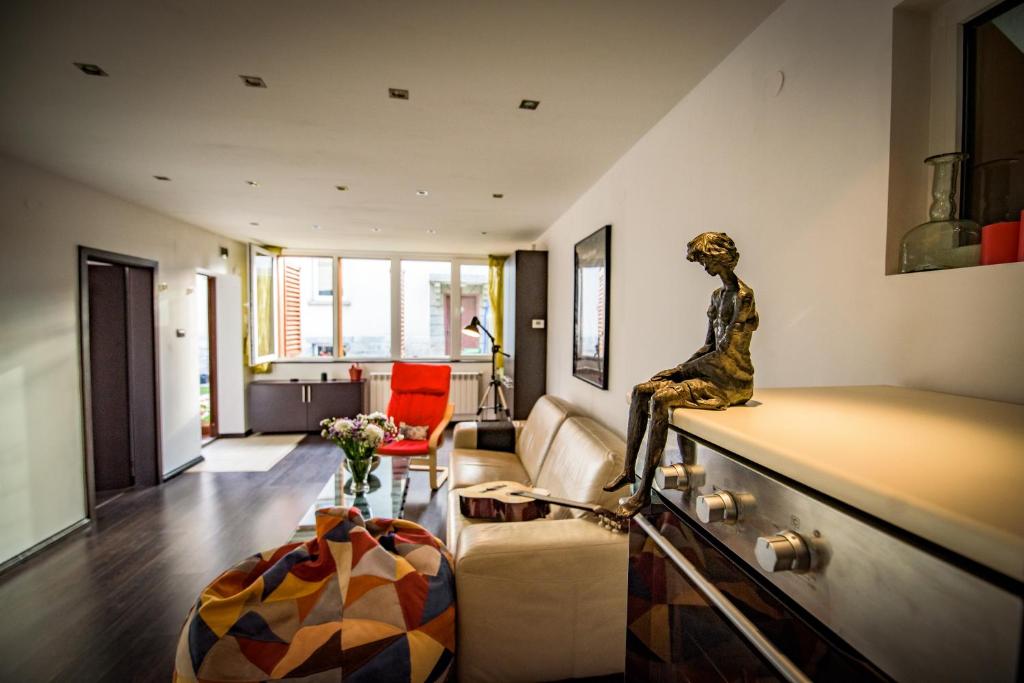 a living room with a statue sitting on a counter at The Clock house in Samokov