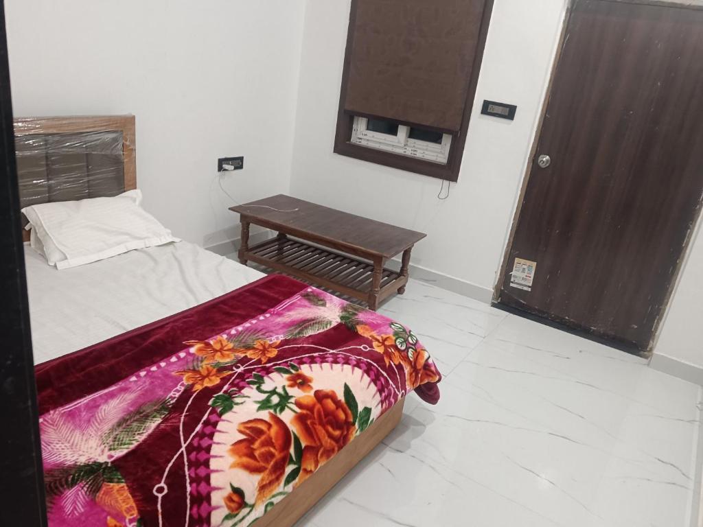 Postel nebo postele na pokoji v ubytování HOTEL TOWN INn