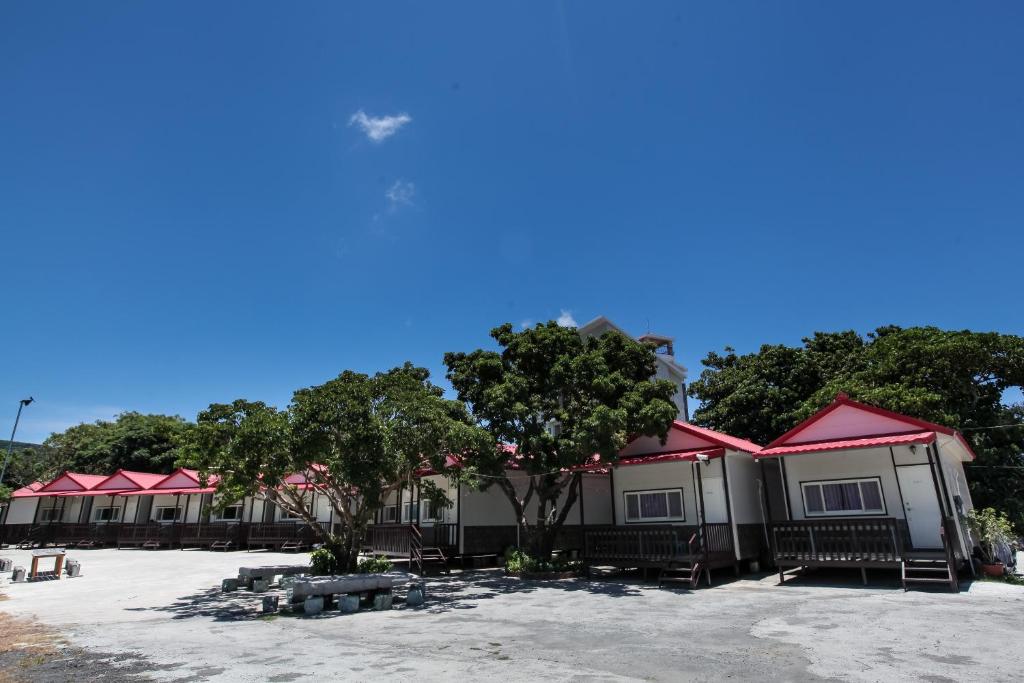 a row of mobile homes with red roofs at Kenting Dream House in Kenting