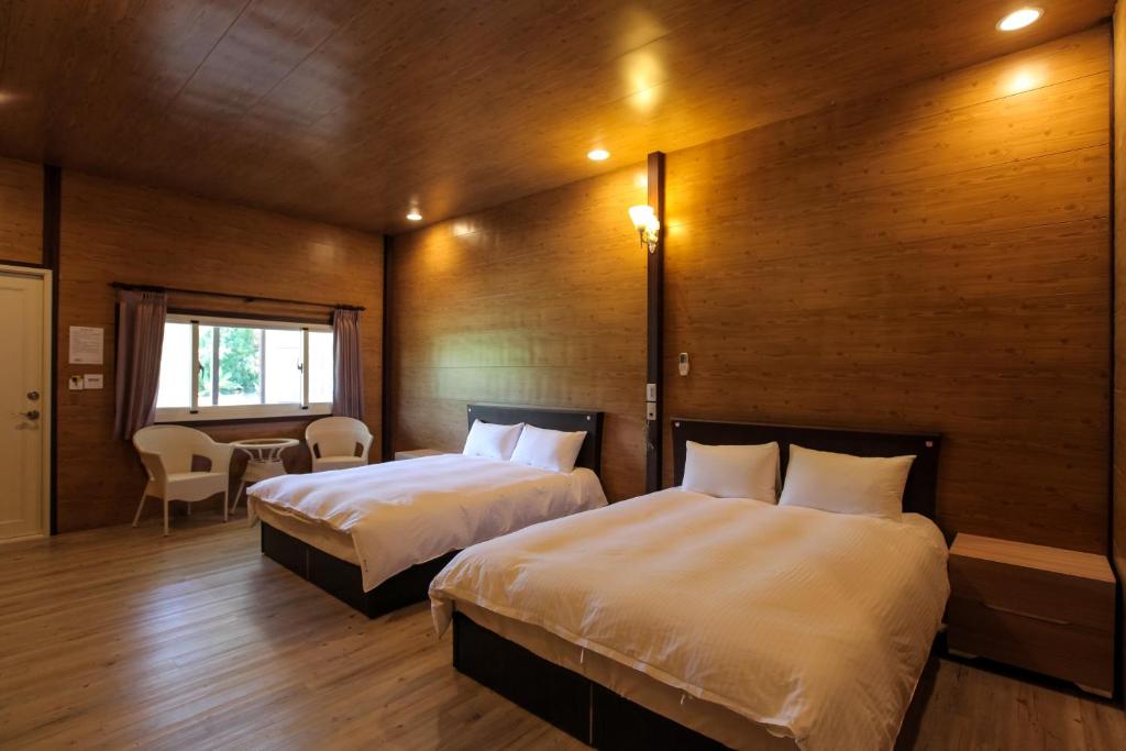 Rúm í herbergi á Kenting Dream House