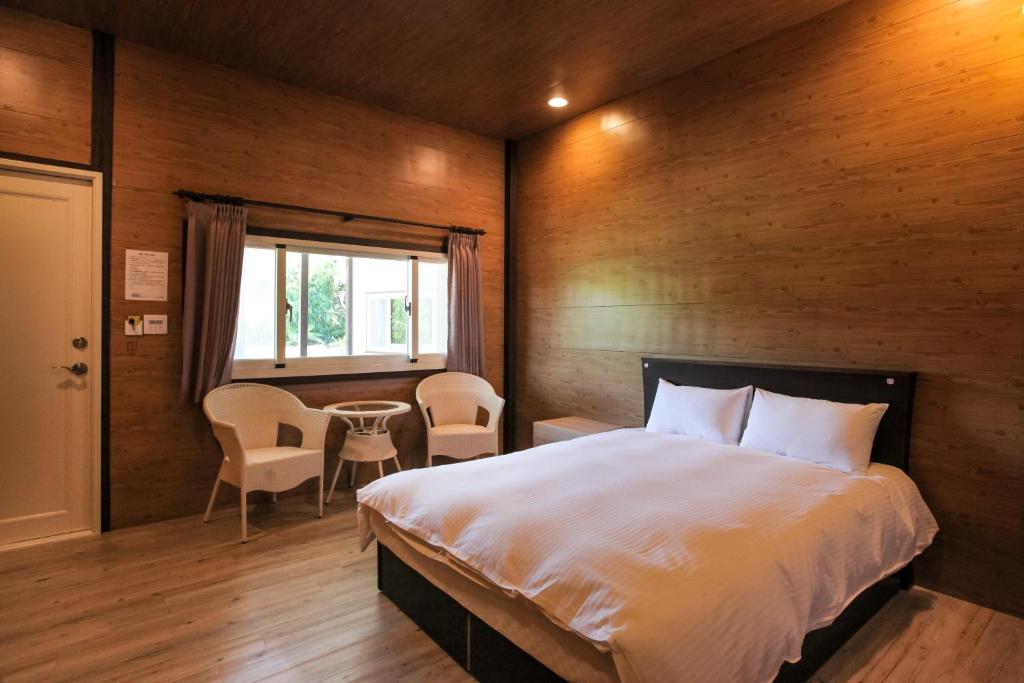 Rúm í herbergi á Kenting Dream House