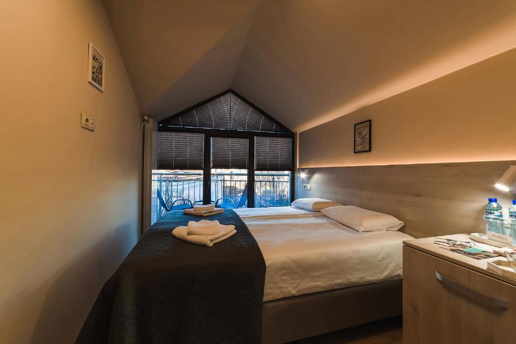 Postel nebo postele na pokoji v ubytování Hotel Avalon Kyustendil