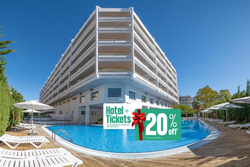 a hotel with a sign in front of a swimming pool at Ponient Pirámide Salou by PortAventura World in Salou