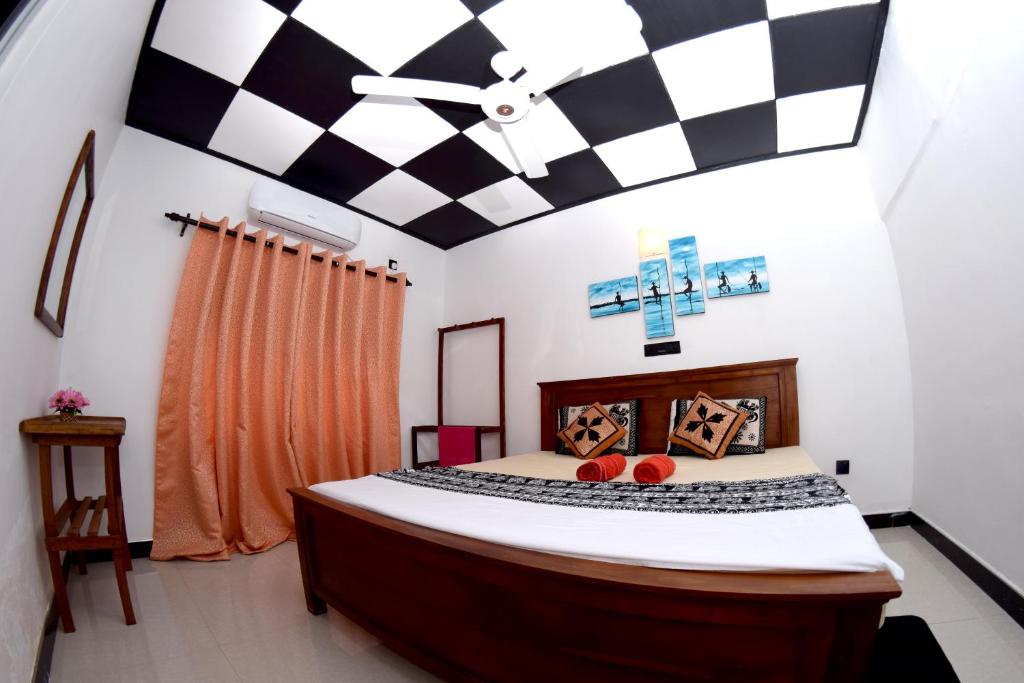 Postel nebo postele na pokoji v ubytování Royal Residence Negombo